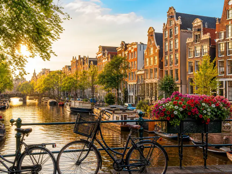 Amsterdam canal with gabled houses and bicycles