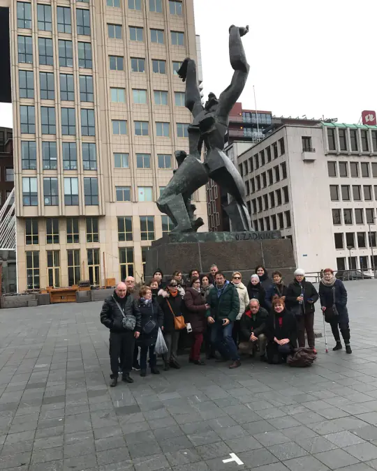 A tour group at the Zadkine monument to the destroyed city in Rotterdam
